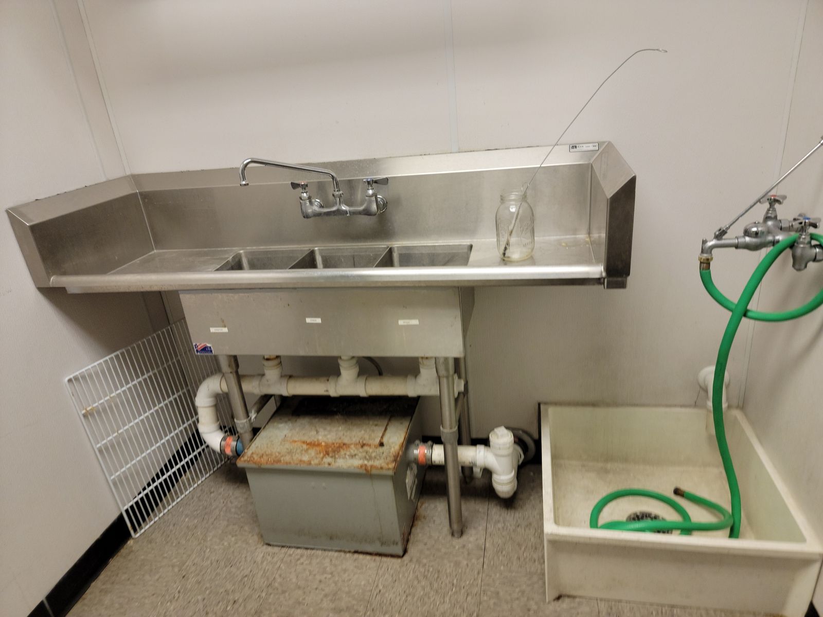 Grease interceptor serving the kitchen sanitary system.